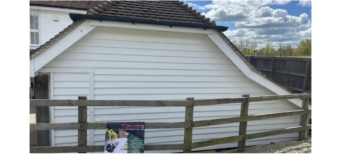 The same cladding cleaned back to white, photographed from the same spot