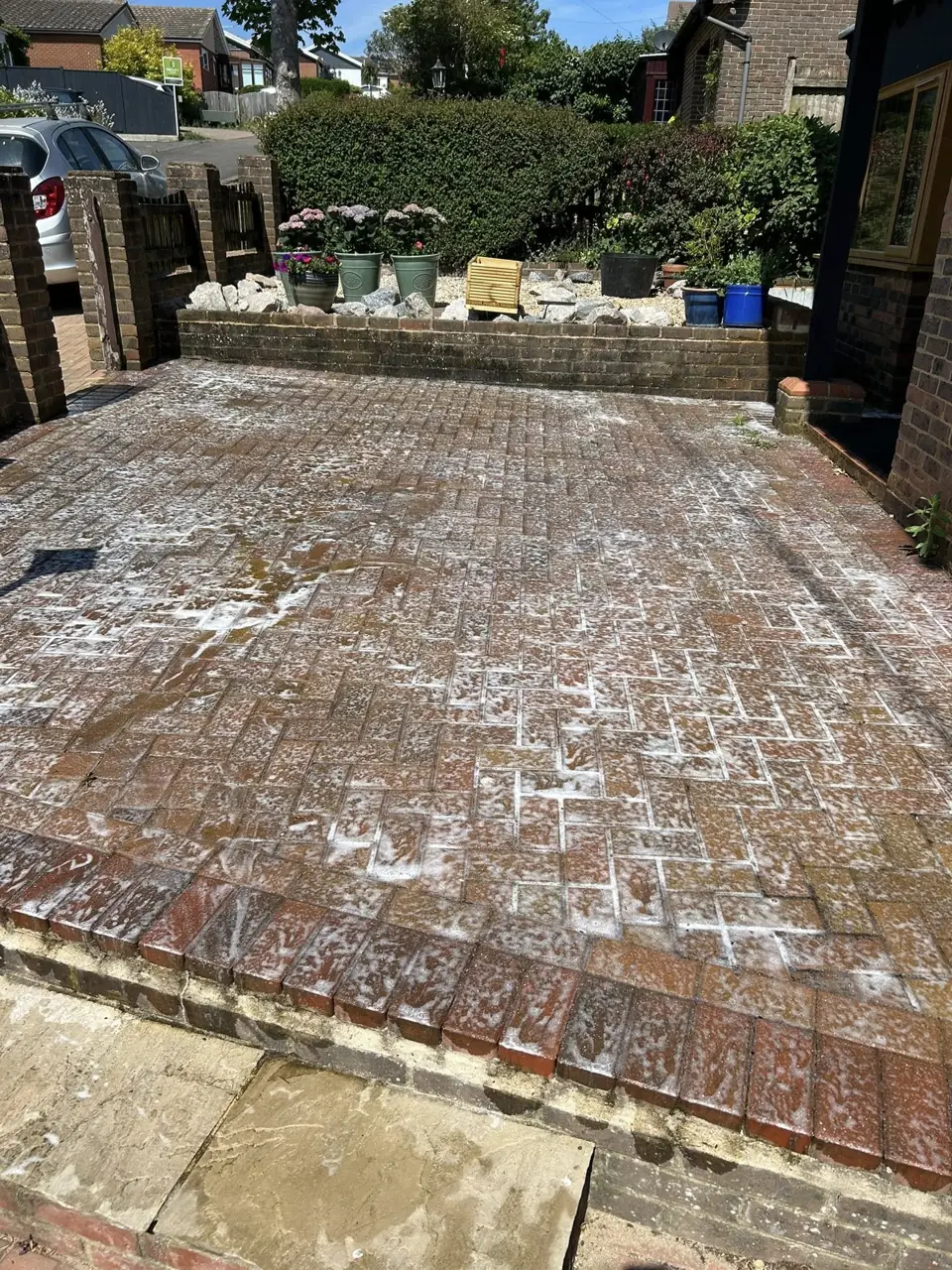 Block paving stained and weathered before pressure washing